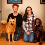 Everett&rsquo;s Wendy Whiteley (left) with Zoom, her Finnish Spitz, gets together at her Lowell neighborhood home with Shahntae Martinez and her Field Spaniel, Hudson. Martinez, a 17-year-old Sequoia High School student, and Whiteley will compete with their dogs next week at the Westminster Kennel Club Dog Show in New York City. (Dan Bates / The Herald)