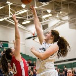 Lynnwood&rsquo;s Kelsey Rogers shoots the ball over a Snohomish defender during the championship game of the 3A District 1 girls basketball tournament Feb. 17, 2017, at Jackson High School in Mill Creek. Lynnwood beat Snohomish 55-53. (Daniella Beccaria / The Herald)