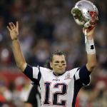 New England quarterback Tom Brady raises his helmet in celebration after the Patriots scored the winning touchdown in overtime Sunday in Houston. (AP Photo/Darron Cummings)