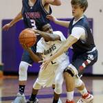 Stanwood&rsquo;s Cameron Plautz (left) and AJ Martinka surround an Edmonds-Woodway player during a game Jan. 3, 2017, in Edmonds. (Andy Bronson / The Herald)