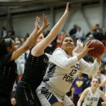 Glacier Peak&rsquo;s Kayla Watkins (right) goes up for a shot during the Class 4A District 1 girls basketball championship game against Lake Stevens at Everett Community College on Thursday, Feb. 16. Glacier Peak went on to defeat Lake Stevens 60-41. (Ian Terry / The Herald)