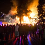 Onlookers gather to watch a fire that occurred at an apartment complex under construction on Scriber Lake Road in Lynnwood on Wednesday, Jan. 25, 2017. (Ian Terry / The Herald)