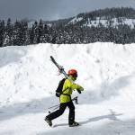 Matt Holland, of Leavenworth, walks through the Stevens Pass parking lot Tuesday following his 29th day on skis this season. &ldquo;It&rsquo;s been killer,&rdquo; Holland said of this year&rsquo;s ski conditions, &ldquo;especially after a couple of crummy seasons.&rdquo; (Ian Terry / The Herald)