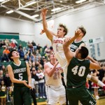 Stanwood&rsquo;s AJ Martinka shoots the ball through Shorecrest defenders during the championship game of the 3A District 1 boys basketball tournament Feb. 17, 2017, at Jackson High School in Mill Creek. Shorecrest beat Stanwood 55-52. (Daniella Beccaria / The Herald)