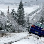 The driver of this car ended up in a ditch while trying to get down steep Cavalero Hill on 20th Street E in Everett on Monday. (Dan Bates / The Herald)