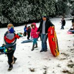 At the small park next to Pilchuck Elementary School in Lake Stevens, parents treat their kids to some sledding. (Dan Bates / The Herald)
