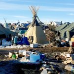 Debris is piled on the ground awaiting pickup by cleanup crews last week at the Dakota Access oil pipeline protest camp in southern North Dakota near Cannon Ball. (AP Photo/Blake Nicholson)