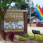 Cutline: The rainbow flag shown here, a symbol of welcome to the LGBT community, was recently stolen from Edmonds Lutheran Church, and someone duct-taped an anti-gay cardboard sign to the church readerboard. (Courtesy Edmonds Lutheran Church)