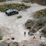 Members of the National Guard patrol the Rio Grande at the Texas-Mexico border in Rio Grande City, Texas, in 2015. The Trump administration is considering a proposal to mobilize as many as 100,000 National Guard troops to round up unauthorized immigrants, including millions living nowhere near the Mexico border, according to a draft memo obtained by The Associated Press. (AP Photo/Eric Gay, File)
