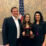 Olivia Olson, center, celebrates her third-place honors in the state-level VFW Voice of Democracy Audio Essay contest, with her parents, Greg and Vivian. (Contributed photo)