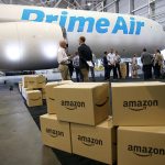 Amazon.com boxes are seen stacked near a Boeing 767 Amazon &ldquo;Prime Air&rdquo; cargo plane on display in a Boeing hangar in Seattle in August. (AP Photo/Ted Warren)