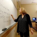 Pat Winters Lauro, a journalism professor at Kean University in Union, New Jersey, leads a class discussion talking about fake news. Teachers from elementary school through college have been ramping up media literacy training to recognize bogus reports and understand their potential to weaken civic culture. (AP Photo/Julio Cortez)