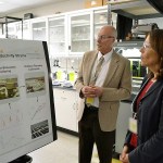 This photo taken in July 2016 shows Michael Huesemann, lead researcher for the algae biofuel program at the Pacific Northwest National Laboratory in Sequim, meeting with U.S. Sen. Maria Cantwell about algae and its potential. (Matthew Nash/The Peninsula Daily News via AP, file)