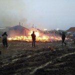 Dakota Access pipeline opponents burn structures in their main protest camp in southern North Dakota near Cannon Ball, North Dakota, on Wednesday, Feb. 22, as authorities prepare to shut down the camp in advance of spring flooding season. (AP Photo/James MacPherson)