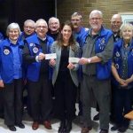 The Edmonds Lions Club presents a check for $5,600 to Edmonds Food Bank Director Alyson Cook (center) at its Jan. 23, 2017 meeting. On either side of Cook are Edmonds Lions Club co-chairs Vern Woods (left) and James Forgey (right). (Contributed photo)