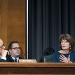 Senate Health, Education, Labor, and Pensions member Sen. Pat Roberts, R-Kan. listens as left as fellow committee member Sen. Lisa Murkowski, R-Alaska speaks on Capitol Hill in Washington on Tuesday, Jan. 31, during the committee&rsquo;s executive session for Education Secretary-designate Betsy DeVos. (AP Photo/Alex Brandon)
