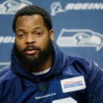 Seattle Seahawks defensive end Michael Bennett talks to reporters in January at the team headquarters in Renton. In a letter posted on Twitter, Bennett announced he is pulling out of a planned trip to Israel, accusing its government of trying to use him for PR purposes. (Ted S. Warren/AP, File)