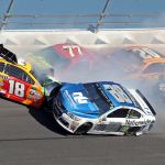 Dale Earnhardt Jr. (88) hits Kyle Busch (18) along with Erik Jones (77), Matt Kenseth (20) and Elliott Sadler (7) during the NASCAR Daytona 500 auto race at Daytona International Speedway in Daytona Beach, Fla., Sunday, Feb. 26. (AP Photo/John Chilton)