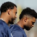 The Mariners&rsquo; Nelson Cruz (left) and Robinson Cano walk to a drill during spring training Feb. 21, 2017, in Peoria, Ariz. (AP Photo/Charlie Riedel)