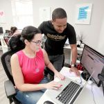 Renata Adams is social account manager and Andre Kay is CEO of SociallyBuzz, a firm that helps small businesses grow using social media and data. (Roberto Koltun / Miami Herald)