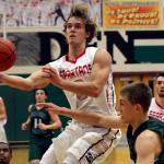 Stanwood&rsquo;s AJ Martinka attempts a shot past Edmonds-Woodway&rsquo;s Ryan Peterson Wednesday night at Henry M. Jackson in Everett on February 15, 2017. (Kevin Clark / The Herald)