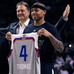 Celtics guard Isaiah Thomas (4) holds up his NBA All-Star jersey prior to the first quarter of a game against the 76ers in Boston, Wednesday. At rear is Celtics co-owner Steve Pagliuca. (AP Photo/Charles Krupa)
