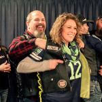 Joe Wardlaw badges Cami Schamp as a member of the Guardian of the Children Cascade Chapter Saturday night at the Everett Eagles Club on January 14, 2017. (Kevin Clark / The Herald)