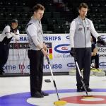 Alex Fenson (left) talks with his father and teammate, Pete Fenson, about stone placement Sunday afternoon during the 2017 USA Curling Nationals at Xfinity Arena in Everett. (Kevin Clark / The Herald)