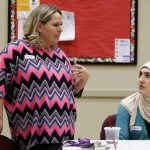 Teena Ellison (left) talks as friend and fellow Everett community member Shehed Al-Azadi listens during an informal meeting at Pineview Community Center in Everett on Thursday. (Ian Terry / The Herald)
