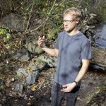 University of Washington Bothell biology major Scott Miller surveys Swamp Creek for any signs of Kokanee and to gather information for a restoration report. (Celeste Gracey / Special to the Reporter)