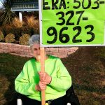 Mary Whitmore, who worked for ratification of the Equal Rights Amendment in the 1970s and &rsquo;80s, holds a sign to demonstrate her support of a new push for the ERA last weekend in Coupeville. The amendment fell short of ratification, by three states, before a 1982 deadline. Whitmore is heading a new Island County Democrats ERA committee. (Courtesy Mary Whitmore)