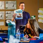 A Wounded Warrior Fellow with U.S. Rep. Suzan DelBene&rsquo;s office, Benjamin Studley, 37, talks to students at Machias Elemenary School before picking up Valentine cards they made for veterans at the VA Puget Sound hospital in Seattle. Here, Studley, who attended Machias Elementary himself, shows students a few of the cards he received from Machias Elementary students while he served aboard a ship in the United States Navy. (Dan Bates / The Herald)