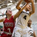 Lynnwood&rsquo;s Nakia Boston grabs a rebound over Snohomish&rsquo;s Katie Brandvold during the championship game of the 3A District 1 girls basketball tournament Feb. 17, 2017, at Jackson High School in Mill Creek. Lynnwood beat Snohomish 55-53. (Daniella Beccaria / The Herald)