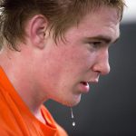 Sweat drips from the chin of Marysville Getchell wrestler Michael Stewart as he watches teammates during practice on Feb. 8, 2017 in Marysville. (Andy Bronson / The Herald)