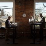 Joel DuChesne and Nathan LeMesurier, left, partners in Parking Boss, an Everett software company, work at their computers in their office on Wednesday, Jan. 11. The software company helps apartment and condo building owners deal with parking arrangements for residents, visitors and guests. (Andy Bronson / The Herald)
