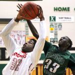Stanwood&rsquo;s Austin Wilhonen attempts a shot with Edmonds-Woodway&rsquo;s Mutdung Bol defending Wednesday night at Henry M. Jackson in Everett on February 15, 2017. (Kevin Clark / The Herald)