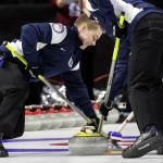 Lake Stevens&rsquo; Luke Violette (left) and Issaquah&rsquo;s Ben Richardson sweep the ceremonial opening stone during the opening ceremony of the 2017 USA Curling Nationals on Feb. 11, 2017, at Xfinity Arena in Everett. (Kevin Clark / The Herald)