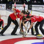 Members of Team Roth sweep a stone for better position Sunday night during the 2017 USA Curling Nationals at Xfinity Arena in Everett on February 12, 2017. (Kevin Clark / The Herald)                                Members of Team Roth sweep a stone for better position Sunday night during the 2017 USA Curling Nationals at Xfinity Arena in Everett. (Kevin Clark / The Herald)