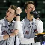 Alex Fenson (left) and his father and teammate, Pete Fenson, await their turn Sunday afternoon during the 2017 USA Curling Nationals at Xfinity Arena in Everett. (Kevin Clark / The Herald)