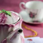 A sample tea setting decorates the table to buy tickets outside St. Mary Magdalen Church in Everett on Sunday. (Kevin Clark / The Herald)