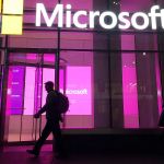 Henry Soto is suing Microsoft after his work with the Online Safety Team. Six years later, he is living with a diagnosis of post-traumatic stress disorder. People walk near a Microsoft office in New York in 2016. (Swayne B. Hall / Associated Press)