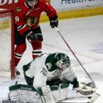 Everett&rsquo;s Carter Hart makes a stop with Portland&rsquo;s Matt Revel looking on during a game Feb. 24, 2017, at Xfinity Arena in Everett. (Kevin Clark / The Herald)