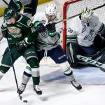 Everett&rsquo;s Brandson Hein works to control the puck with Seattle&rsquo;s Anthony Bishop defending with Seattle&rsquo;s goalie Rylan Toth Sunday night at the ShoWare Center in Kent on February 26, 2017. (Kevin Clark / The Herald)