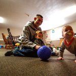 Volunteers like Andrew Nitchman, who has a 3-year-old and 6-year-old of his own, help out in the nursery. Children in the infant nursury are here until they walk. (Dan Bates / The Herald)