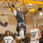 Stanwood&rsquo;s AJ Martinka soars for a layup during a game against Edmonds-Woodway on Jan. 3 in Edmonds. (Daniella Beccaria / The Herald)