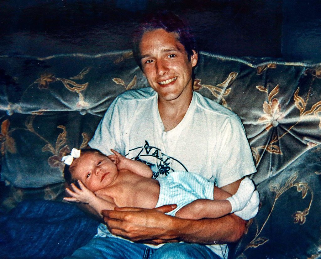 In one of Stephanie Powell Leisure&rsquo;s family photos taken nearly 20 years ago, Gordon &ldquo;Casey&rdquo; Powell holds his newborn niece, MacKenzie. (Photo courtesy Stephanie Powell Leisure)
