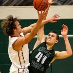 Stanwood&rsquo;s AJ Martinka attempts a shot past Edmonds-Woodway&rsquo;s Ryan Peterson Wednesday night at Henry M. Jackson in Everett on February 15, 2017. (Kevin Clark / The Herald)