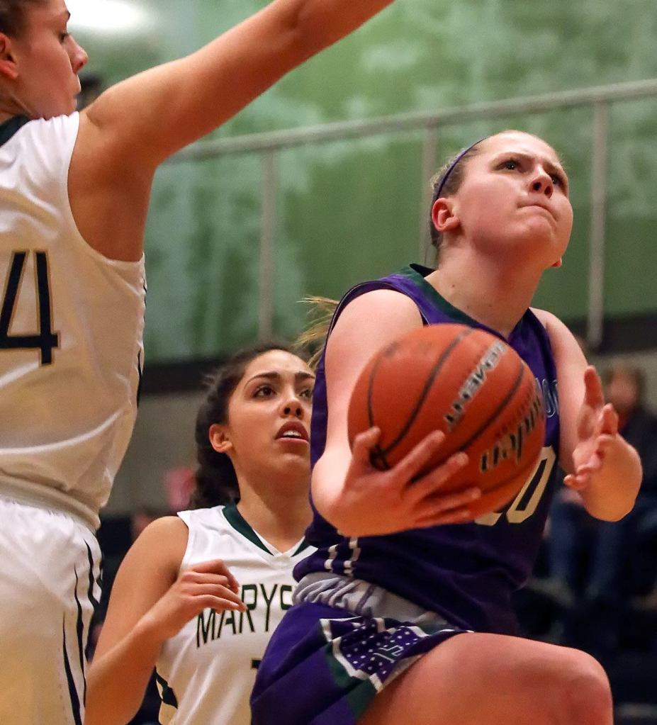 Edmonds-Woodway&rsquo;s Adrienne Poling (right) attempts a shot past Marysville Getchell&rsquo;s Madeline Grandbois (far left) and Jadyn Noriega (center) during a game Feb. 8, 2017, at Marysville Getchell High. Edmonds Woodway won 53-48. (Kevin Clark / The Herald)