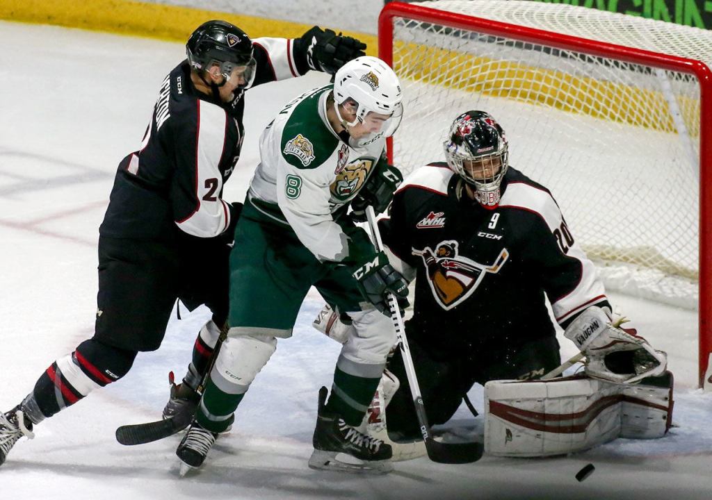 Everett&rsquo;s Patrick Bajkov (middle) is jammed up on a shot with Vancouver&rsquo;s Marcus Kichton (left) and goalie Ryan Kubic defending Saturday night at Xfinity Arena in Everett. (Kevin Clark / The Herald)