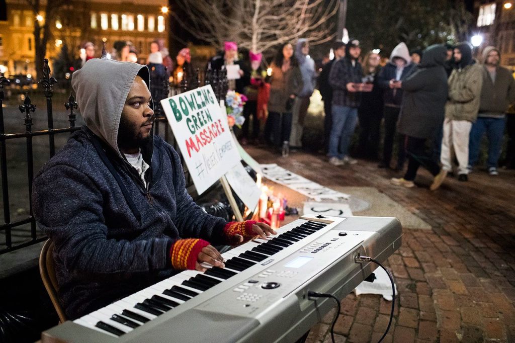 Jerone Williams plays piano during a Bowling Green &ldquo;massacre&rdquo; remembrance gathering Friday at Fountain Square Park in Bowling Green, Kentucky. The &ldquo;massacre&rdquo; that never happened has Bowling Green in the national news again &mdash; something that has not happened since a sinkhole swallowed several prized Corvettes at a museum. (Austin Anthony / Daily News)